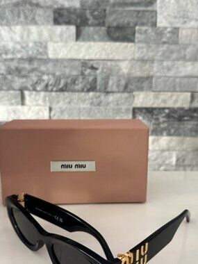 Miu Miu Black Sunglasses with Gold Accents